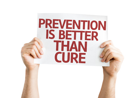 Hands holding Prevention is Better than Cure card isolated on white backgroundの写真素材