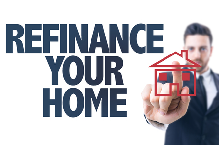 Business man pointing the text: Refinance Your Homeの写真素材