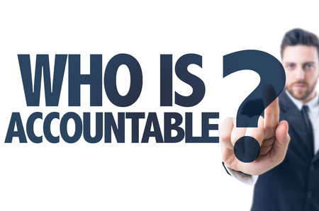 Business man pointing the text Who Is Accountable?の写真素材