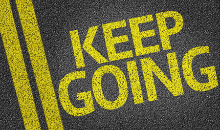 Keep Going written on the roadの写真素材