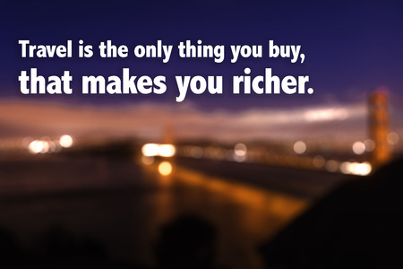 Travel is the only thing you buy that makes you richer on blurred backgroundの写真素材
