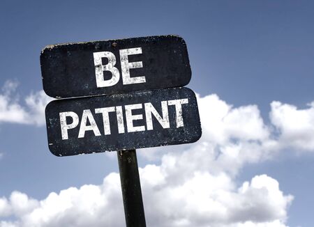 Be Patient sign with clouds and sky backgroundの写真素材