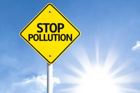 Stop pollution sign with sunny background