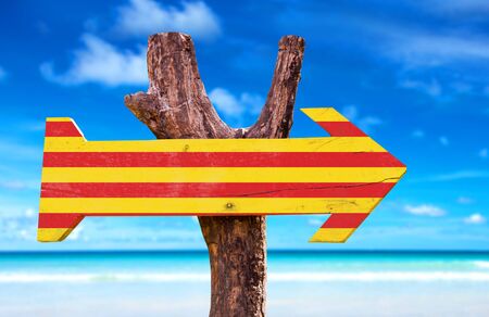Catalonia flag sign with arrow on beach backgroundの写真素材