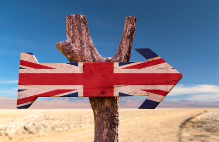 United Kingdom flag sign with arrow on desert backgroundの写真素材