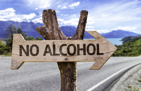 No alcohol sign with arrow on road background