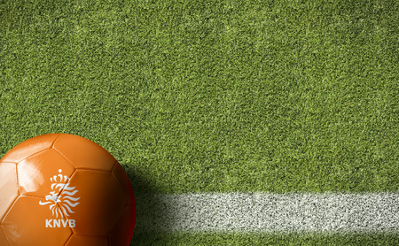 Netherlands flag ball on soccer field backgroundの写真素材