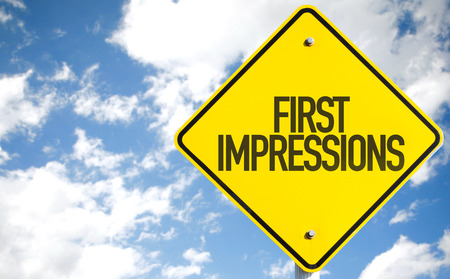 First impressions sign with clouds and sky backgroundの写真素材