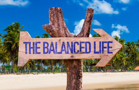 The balanced life sign with arrow on beach backgroundの写真素材