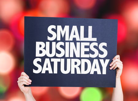 Hands holding cardboard on bokeh background with text: Small business Saturdayの写真素材