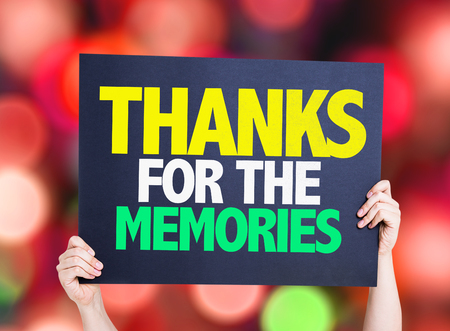 Hands holding cardboard on bokeh background with text: Thanks for the memoriesの写真素材