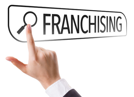Hand searching online on white background with text: Franchisingの写真素材