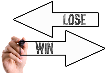 Win and lose written with a marker penの写真素材