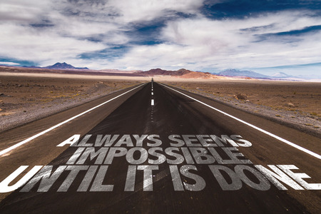 Always seems impossible until it is done written on the roadの写真素材