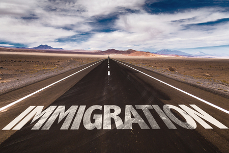 Immigration written on the roadの写真素材