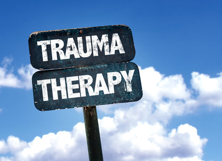 Trauma therapy written on the road sign with clouds and sky backgroundの写真素材
