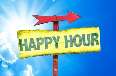 Happy hour sign with arrow on sunny backgroundの写真素材