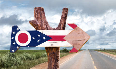 Ohio flag sign with arrow on road backgroundの写真素材