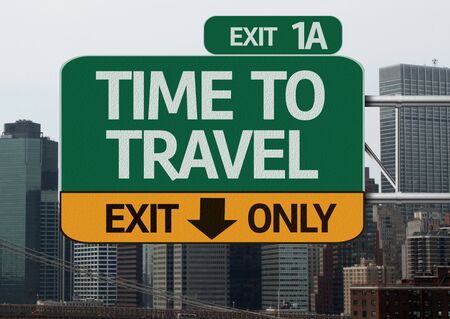 Time to Travel road sign with city backgroundの写真素材
