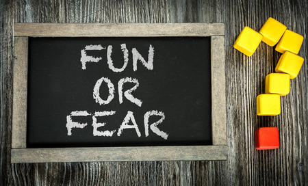 Fun or Fear written on chalkboardの写真素材