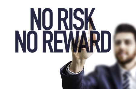 Business man pointing the text: No Risk No Rewardの写真素材