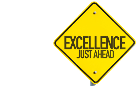 Excellence Just Ahead sign isolated on white backgroundの写真素材