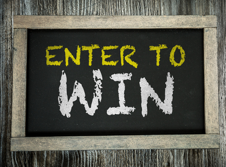 Enter to Win written on chalkboardの写真素材