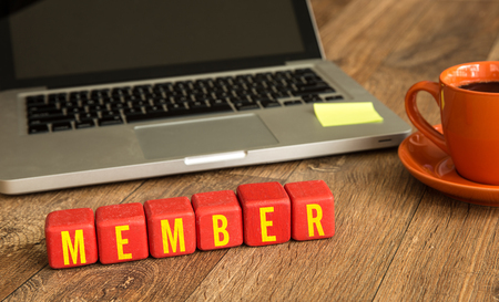 Member written on a wooden cube in a office deskの写真素材