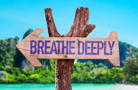 Breathe Deeply arrow with beach backgroundの写真素材