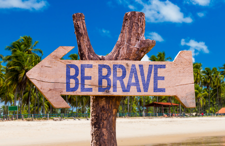 Be Brave arrow with beach backgroundの写真素材