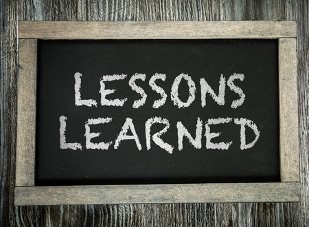 Lessons Learned written on chalkboardの写真素材