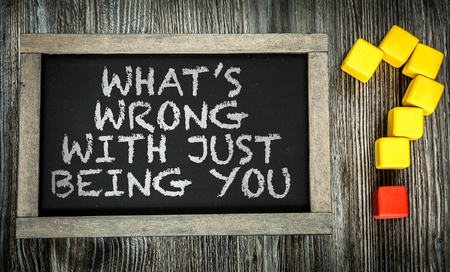 What's Wrong With Just Being You written on a chalkboardの写真素材