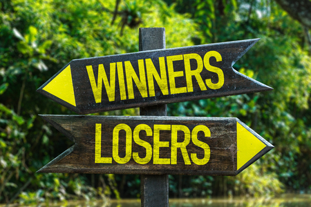 Winners/losers sign with wetland backgroundの写真素材