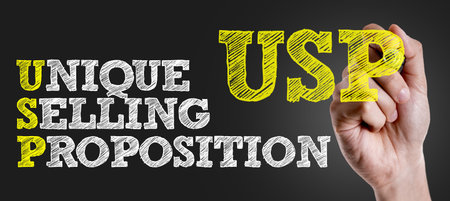 Hand holding a marker with USPの写真素材