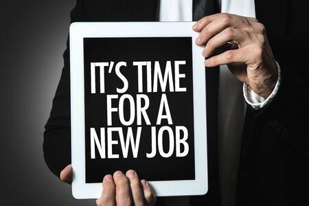 Man holding tablet with its time for a new jobの写真素材