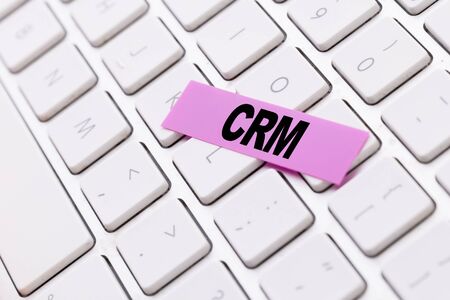 CRM sticky note on keyboardの写真素材