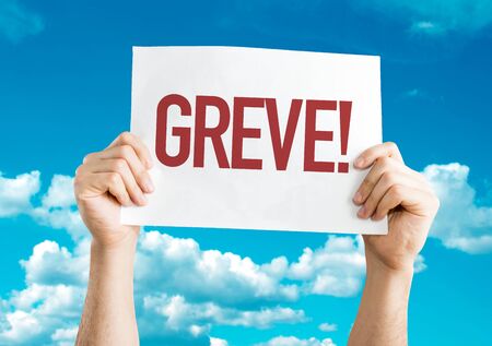 Hands holding placard with the words Greveの写真素材