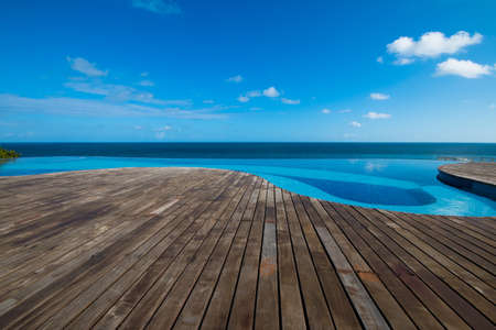 Infinity pool with views of the sea and blue skyの写真素材