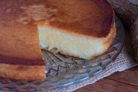 Cassava cake on wooden background. Cut pieceの写真素材