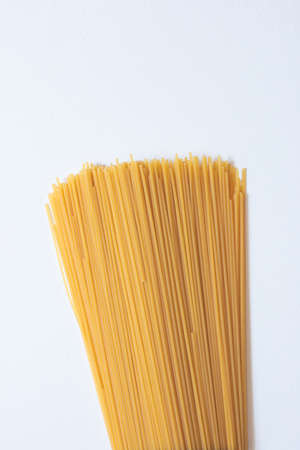 Italian pasta (macaroni) isolated on white background. Space for textの写真素材