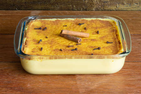 Hominy. Curau. Typical Brazilian junina party sweets. Rustic wood background. Brazilian dessertの写真素材