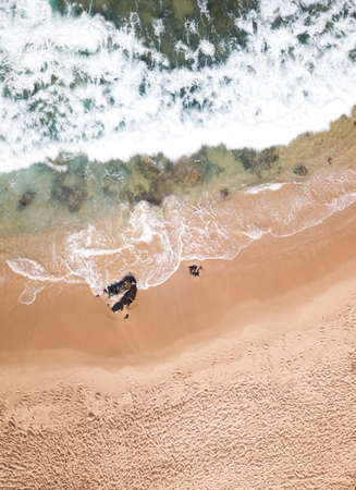 Aerial view drone photo of beach waves.の写真素材