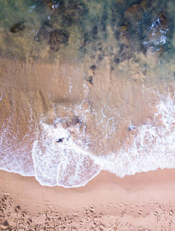 Aerial view drone photo of beach waves.の写真素材