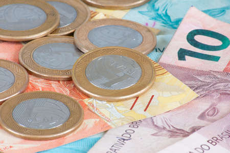 Brazilian money. Coins and money bills of different values stacked. Finance conceptの写真素材