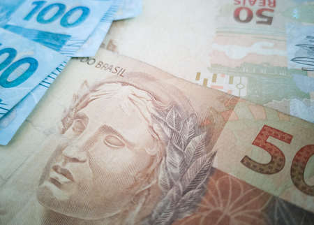 Brazilian money. Money bills of different values stacked. Finance conceptの写真素材