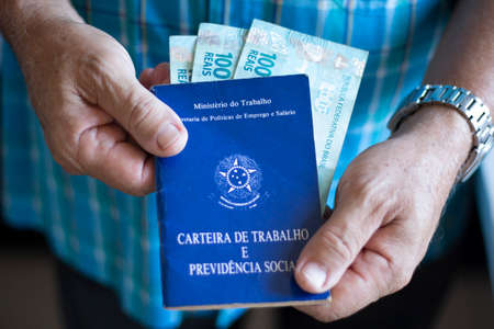 Man holding Brazilian work card. Selective focusの写真素材