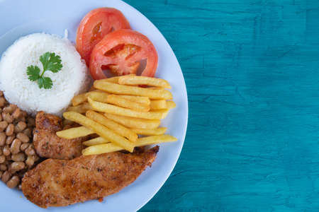 Traditional Brazilian food dish. Blue background. Copy spaceの写真素材
