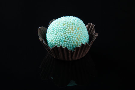 Traditional Brazilian sweet. Party candy isolated on black background