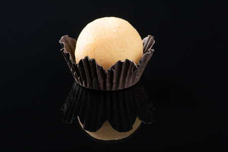 Traditional Brazilian sweet. Party candy isolated on black backgroundの写真素材