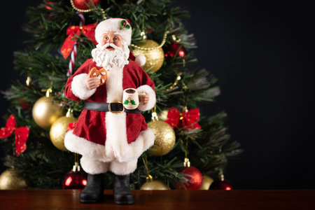 Santa Claus decoration on a christmas tree blurry background. Christmas party